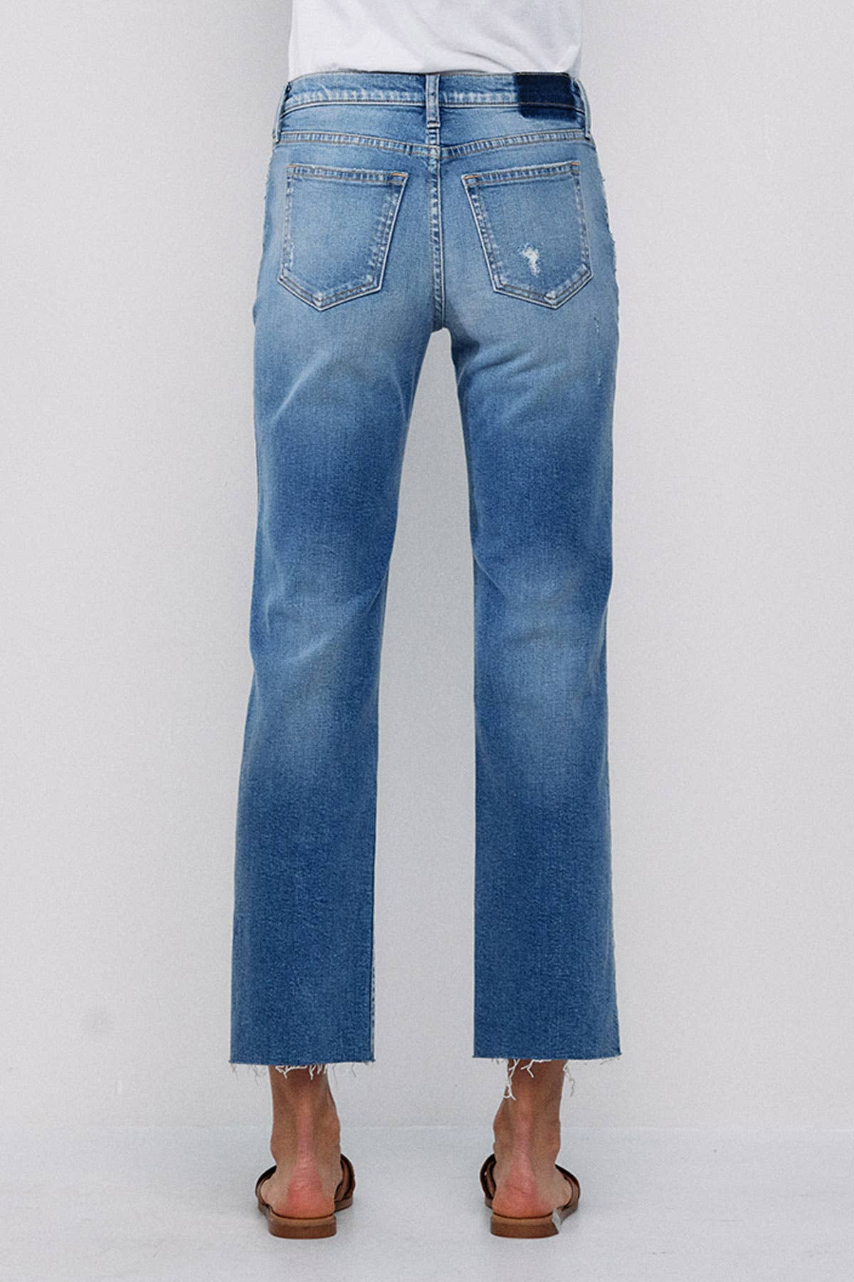 MID RISE STRAIGHT JEANS WITH KNEE RIPS
